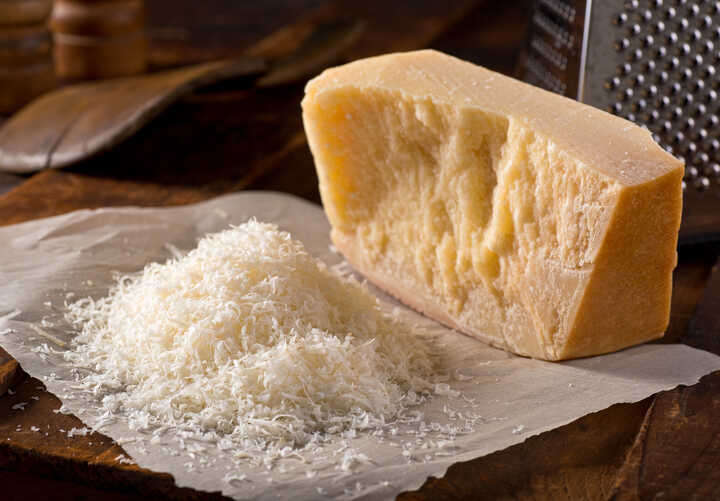 parmesan cheese on a wooden worktop